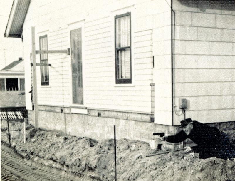 In this 1963 photo, Jerome Walsh is pictured aiming a gun during a farce battle after the State of Delaware seized part of his property to dualize the highway. In a letter to his son Jerry, Jerome wrote, “I had to shoot it out with them. The snapshot was taken at a very critical moment of the gun battle. My front lawn, fence, trellis and shrubbery, flowers, etc. were condemned, executed and buried under the road bed. I haven't got a dime from the Highway Department yet." Jerome did say
the highway looked very nice, with three lanes including shoulders on each side and a 10-foot median narrowed at the ends for turn lanes. WALSH FAMILY PHOTO